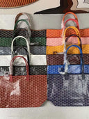 Collection of colorful Élodie Tote Bags with signature patterned finish and detachable pouches in medium and large sizes