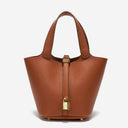 brown vegan leather bucket bag with gold lock and pebbled texture