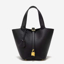 Black Piana bucket bag in premium vegan leather with gold hardware and pebbled texture