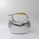 Silver woven handbag with gold-tone handle and spacious interior