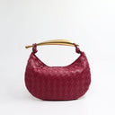 Elegant burgundy woven handbag with gold-tone stainless steel handle