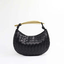 Black woven leather handbag with gold-tone stainless steel handle, spacious interior, and stylish design.