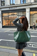 Élodie tote bag in signature patterned finish worn by woman on city street