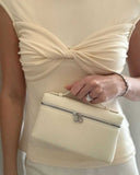Elegant beige Loriana crossbody handbag made of vegan leather with silver zipper detail