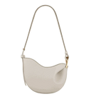 Toscana cross body bag with curved shape and smooth texture in beige with adjustable strap